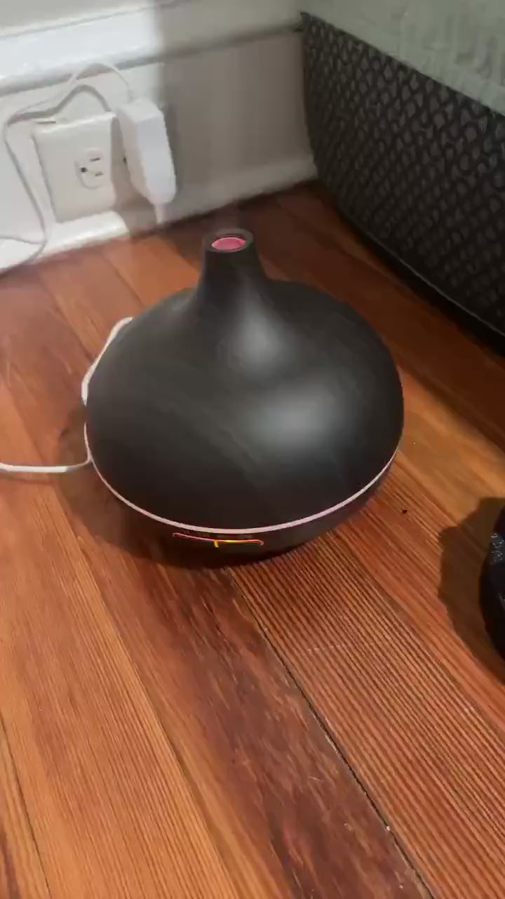 Sarah P. (New York, NY) | Verified Purchase ⭐⭐⭐⭐⭐ | Apartment living in NYC is chaotic. This little machine transforms my small space into a spa. The remote is genius – I can switch the vibe from my desk without breaking my focus. The peppermint oil is a lifesaver for workday headaches.