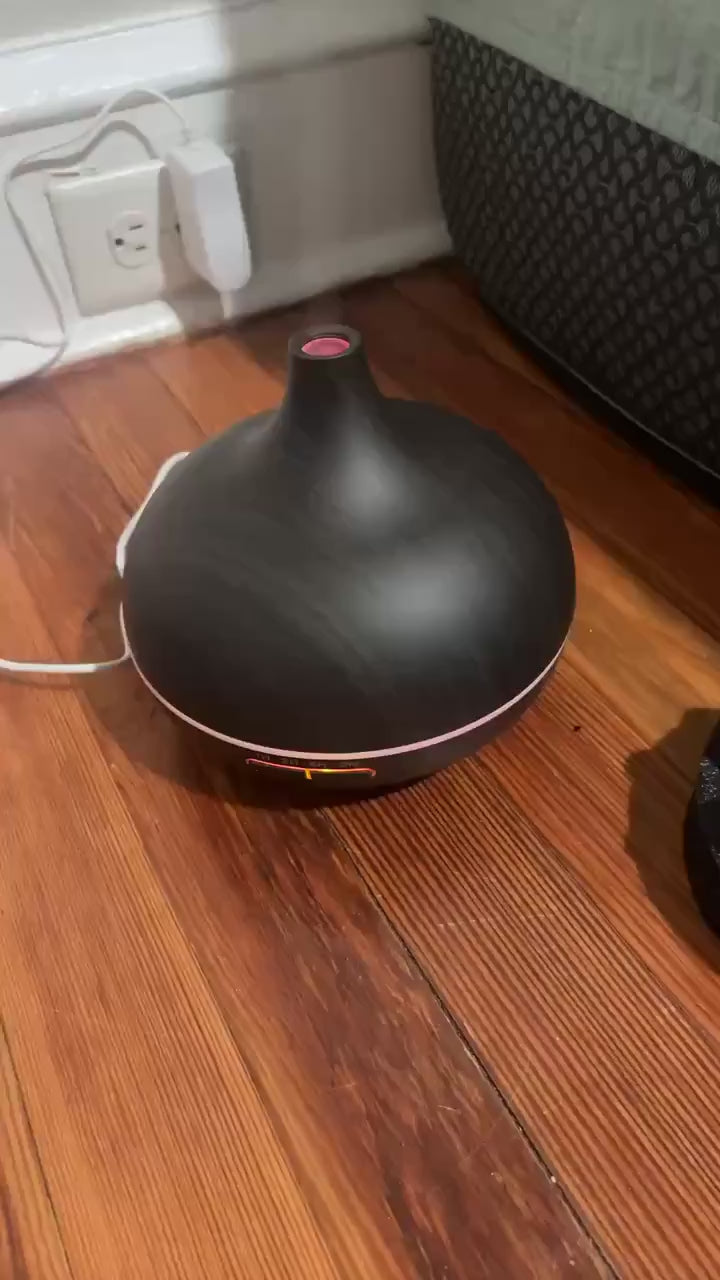 Sarah P. (New York, NY) | Verified Purchase ⭐⭐⭐⭐⭐ | Apartment living in NYC is chaotic. This little machine transforms my small space into a spa. The remote is genius – I can switch the vibe from my desk without breaking my focus. The peppermint oil is a lifesaver for workday headaches.